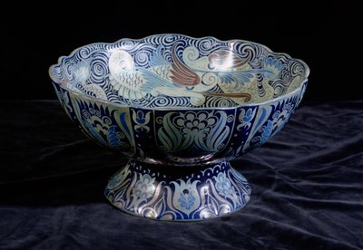 Punch Bowl with ship in the centre and a frieze of fish and waves round the rim by William de Morgan